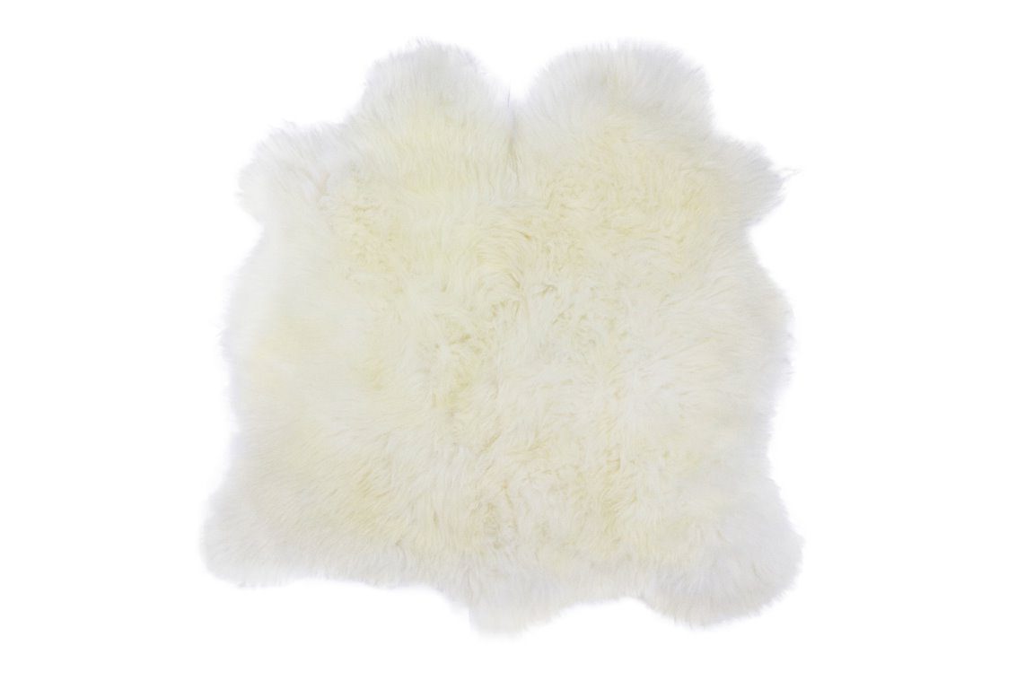 Image of sheep skin rug on a white floor