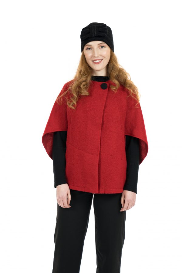 Image of woman wearing a Red short Poncho