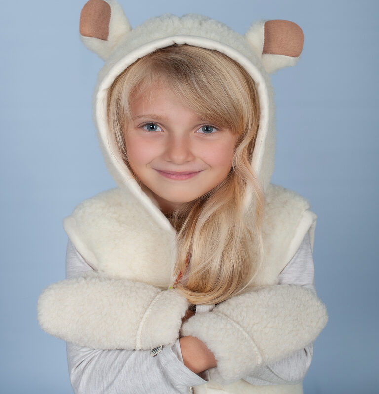 Image of a child wearing a vest sheep product