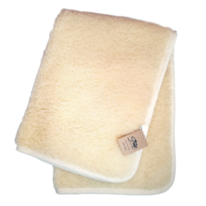 Image of a cashmere baby blanket in beige colour