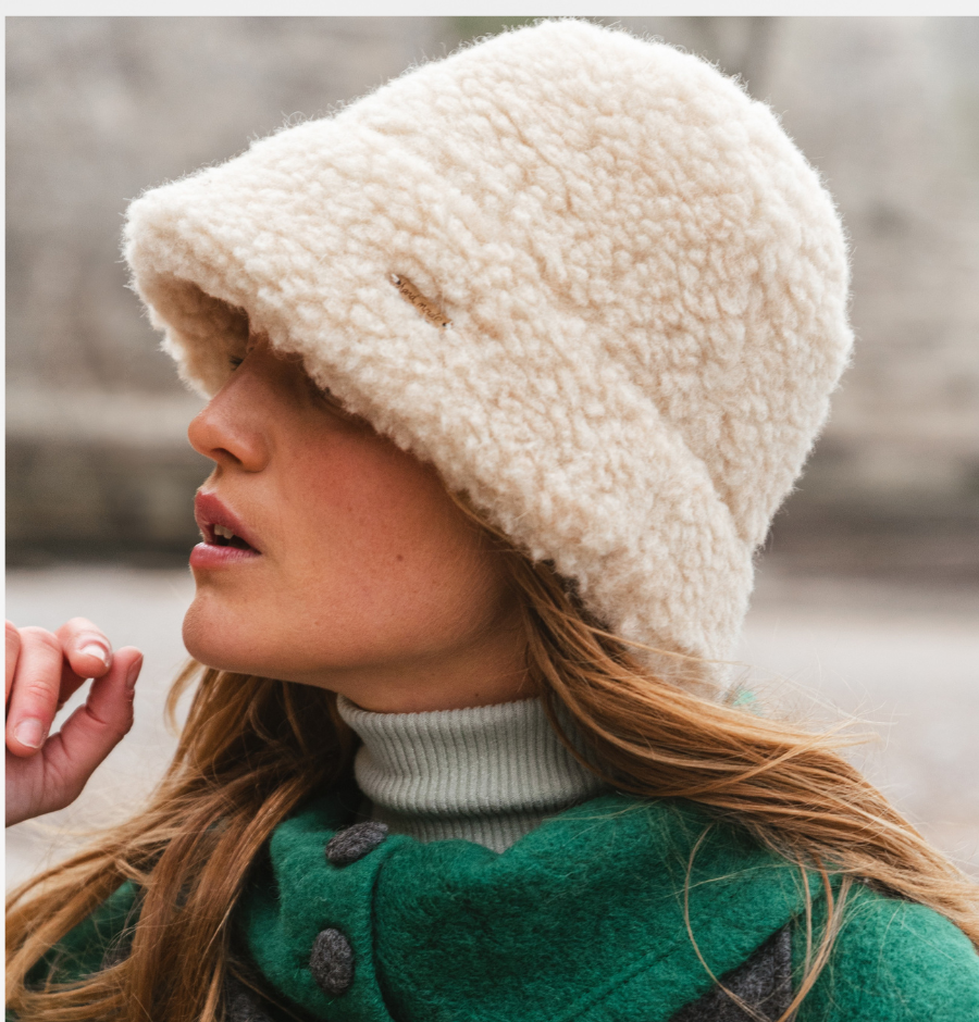 Image of a fluffy beige bucket hat