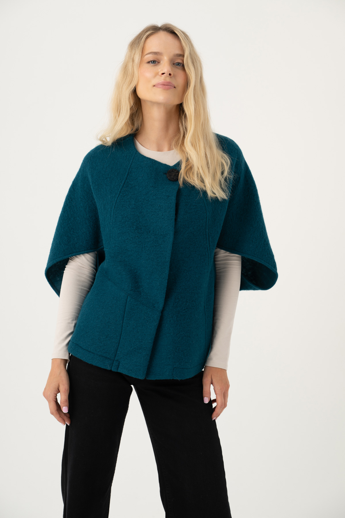 Image of woman wearing a Red short Poncho