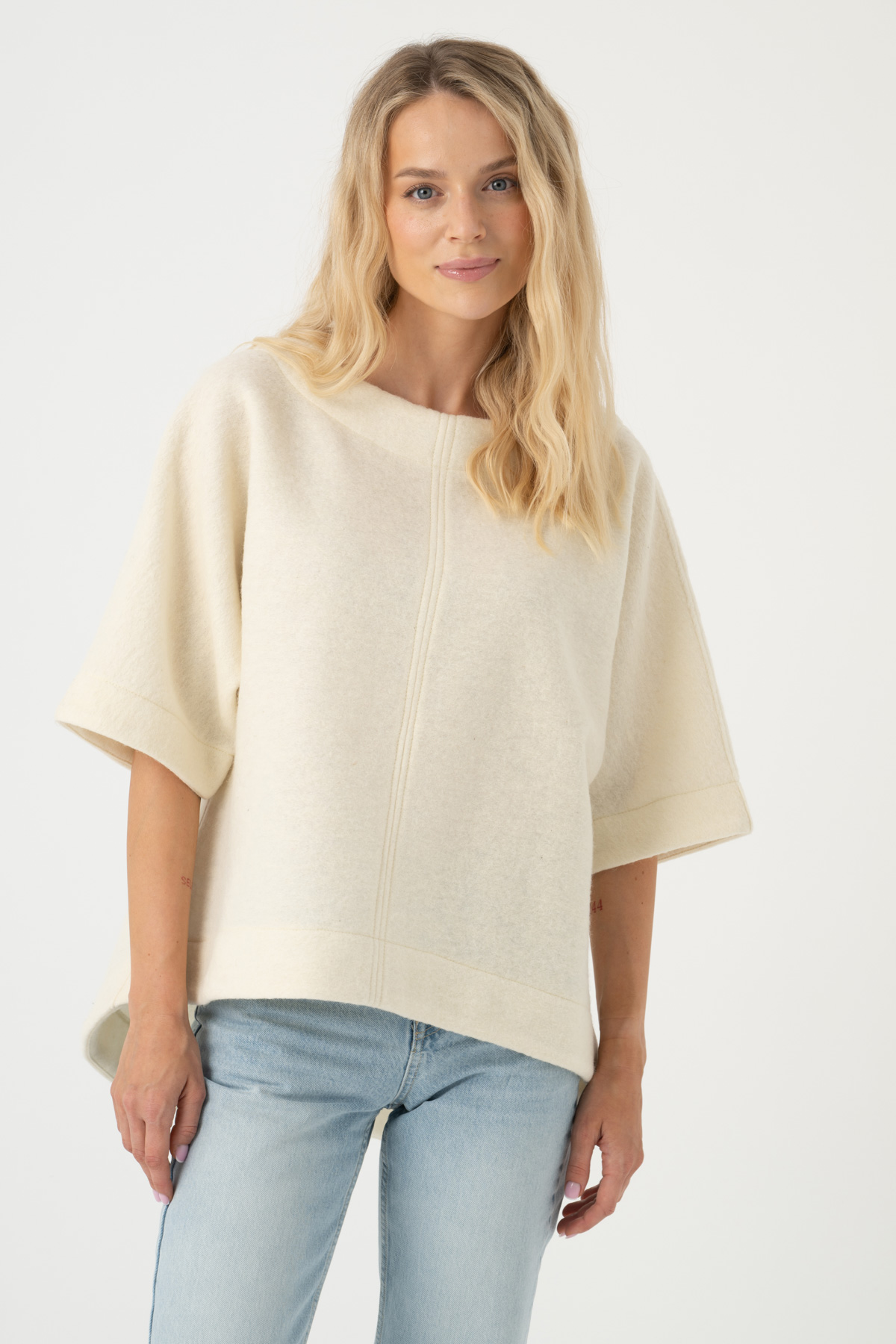 Image of a woman wearing a blue poncho